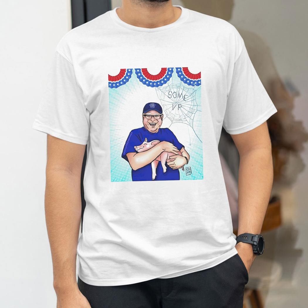 Minnesota Gov Tim Walz Holding A Pigleshirt