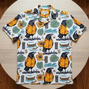 Aloha Crow wearing a Hawaiian shirt. White background, black crows in orange shirts, green leaves, orange flowers.