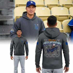 Gray Los Angeles Dodgers Back-to-Back World Champions 2026 For Fan Tee Hoodie featuring blue LA logo & bold 'CHAMPIONS Dodgers' back graphic.