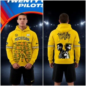 Michigan Wolverines Twenty One Pilots 2026 NCAA March Madness Music Festival Hoodie: yellow, skeleton ribcage, band text, and TØP portraits.
