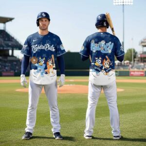 Reading Fightin Phils Bluey Night Baseball Jersey. Blue shirt with Bluey, Bingo, and friends in baseball poses, paw print pattern.