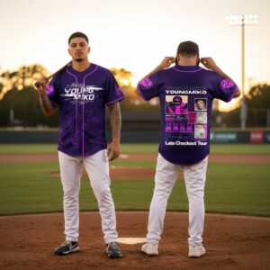 Young Miko 2026 Late Checkout Tour Jersey with black checkerboard pattern, anime eyes on front, 'Young Miko 1K' on back.